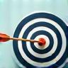 Precision icon with a target and arrow.